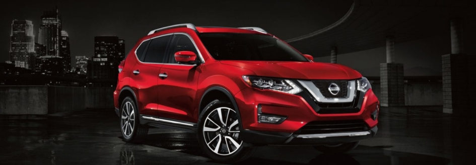 The 2019 Nissan Rogue with a city skyline in the back round